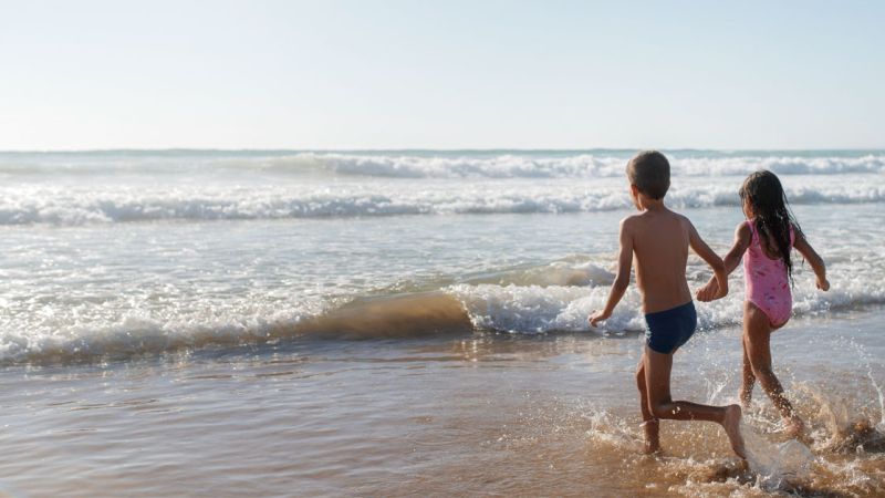 Children playing on Santa Eulalia beach